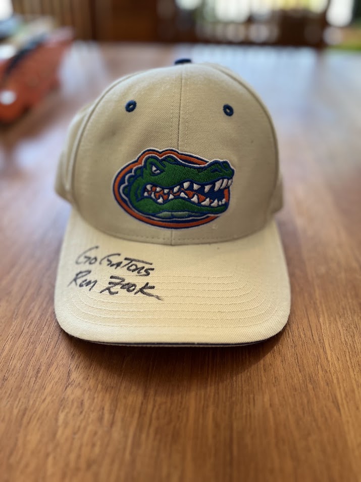 Khaki Gators cap with Go Gators Ron Zook inscription on bill, front