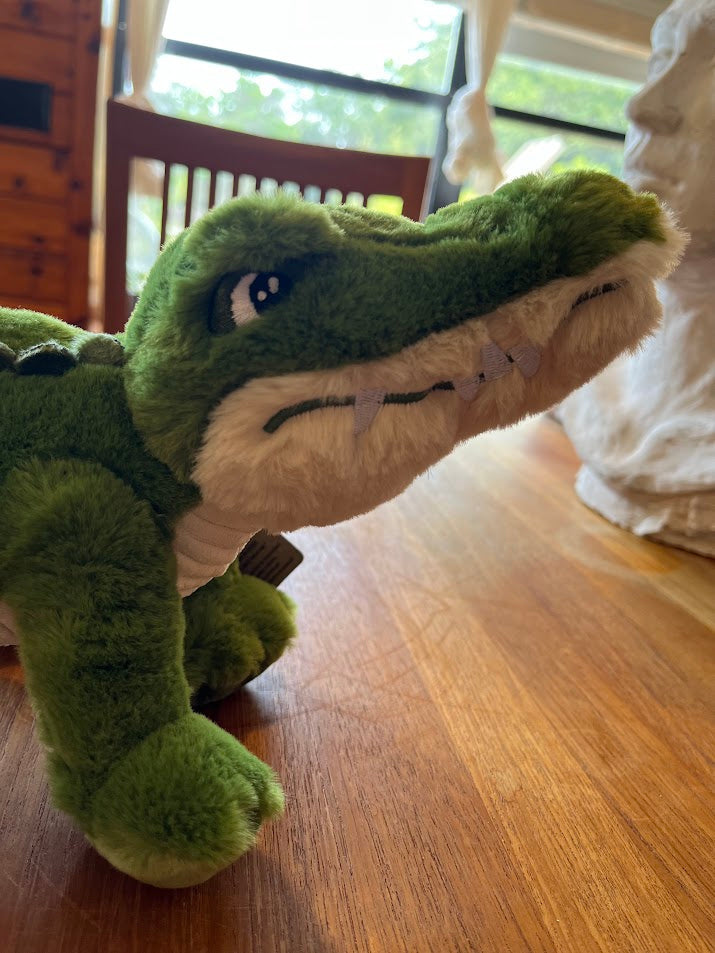 Bernie the Gator plush face close-up showing felt teeth
