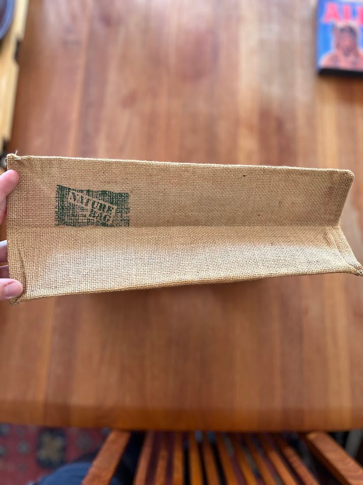 Interior of burlap Gators tote showing worn green maker's stamp