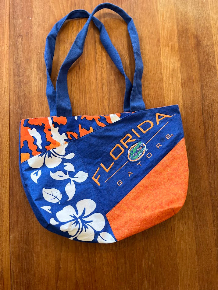 Handmade patchwork tote with hibiscus print, orange panel and Florida Gators logo panel, front