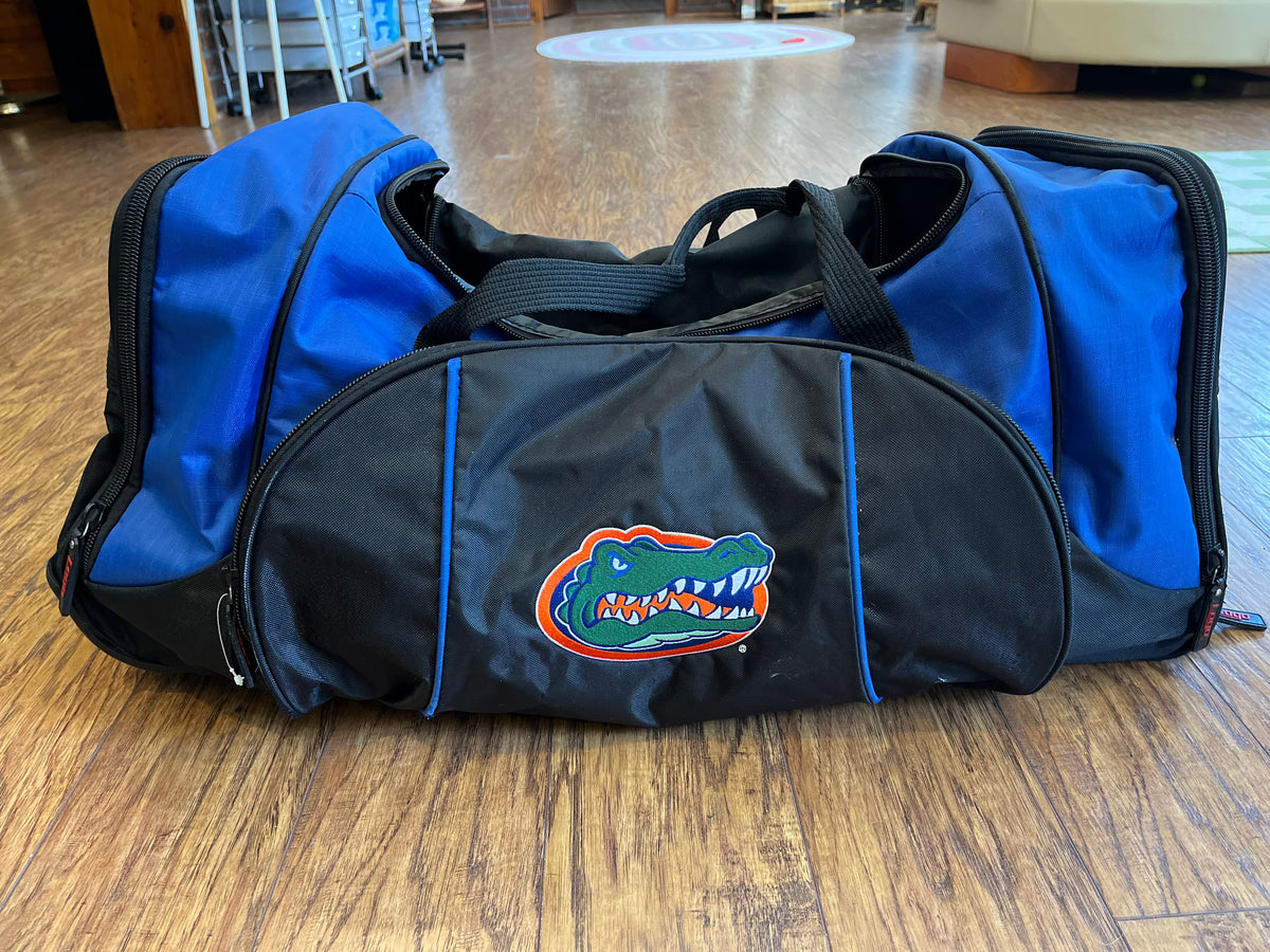 Black and royal Florida Gators rolling duffel with embroidered gator head, front