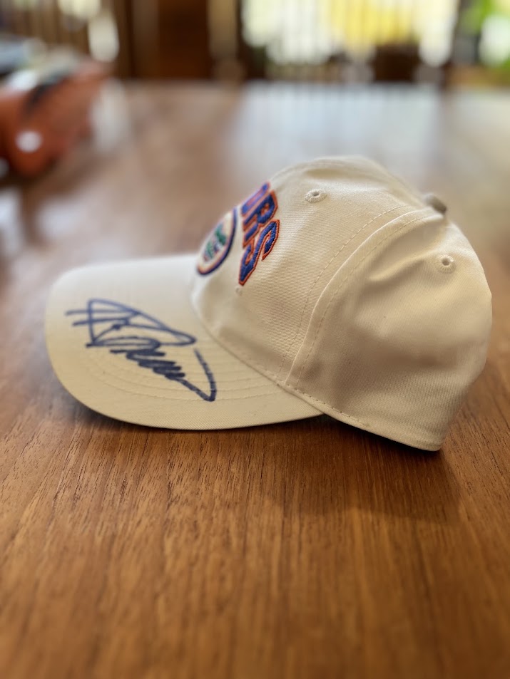 Signed Gators arch cap, angled view of signature on bill