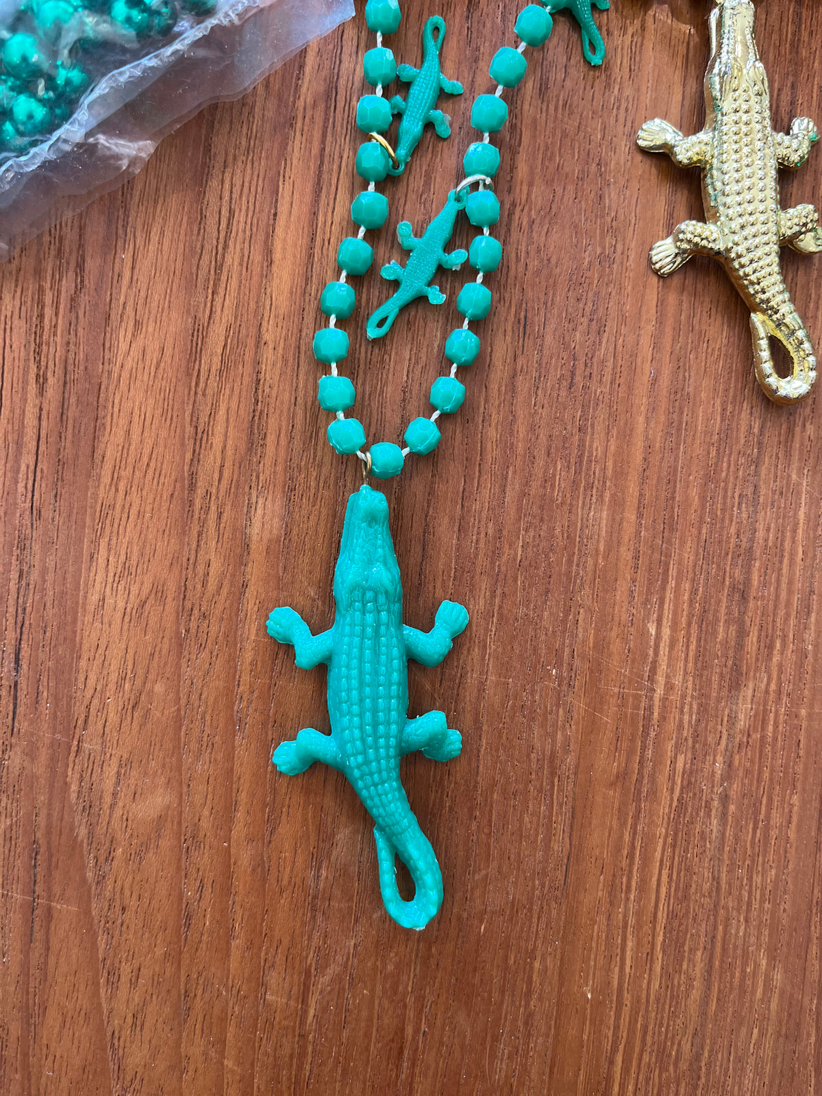 Teal bead necklace with large teal alligator pendant