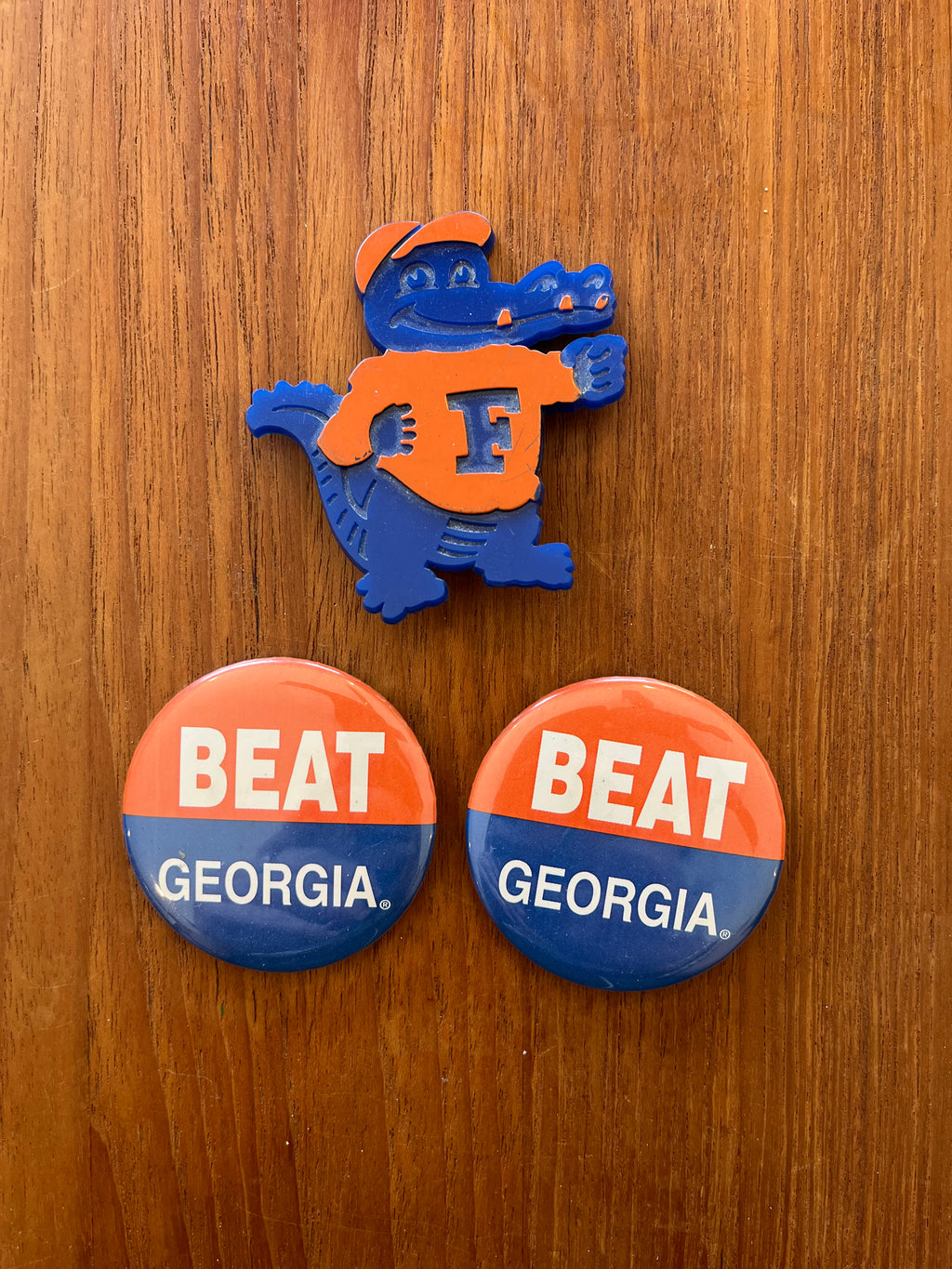 Plastic Albert the Gator pin with two Beat Georgia buttons