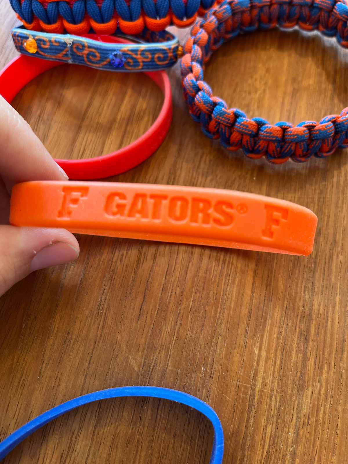 Orange silicone band debossed F Gators F, close-up
