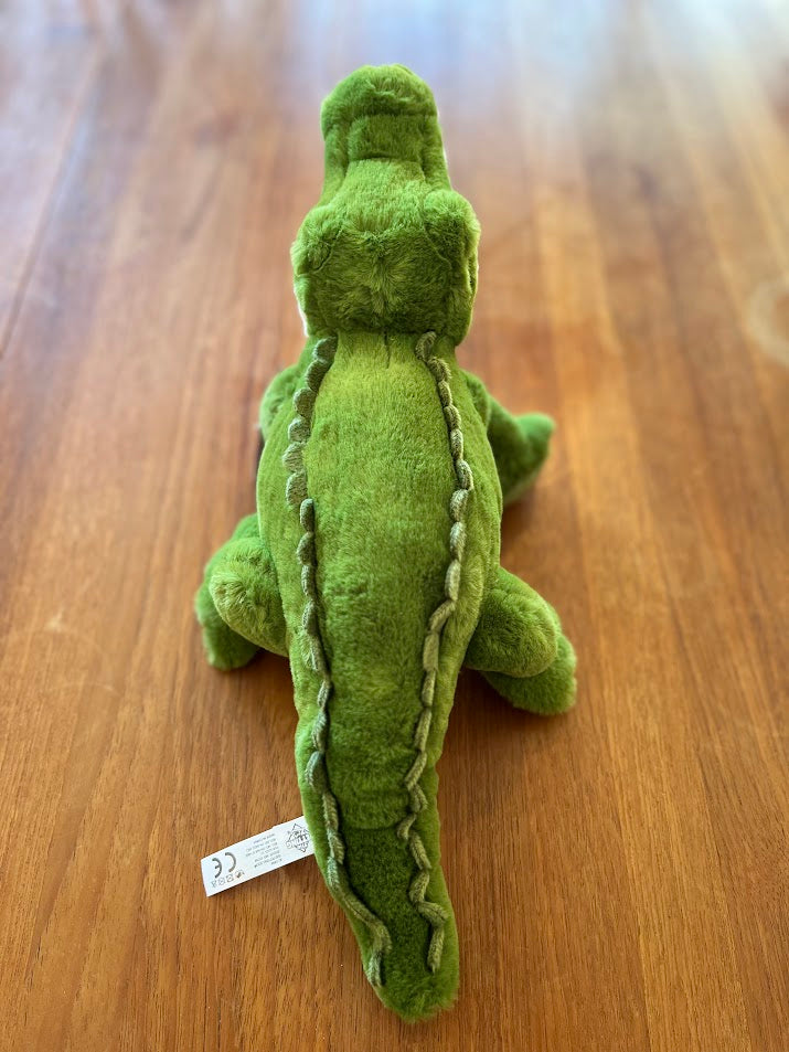 Bernie the Gator plush from behind showing tail and tush tag