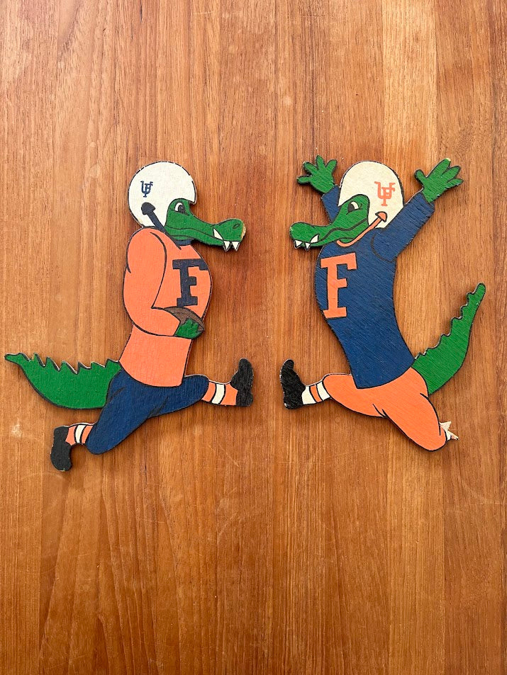 Pair of hand-painted wood Albert the Gator football player magnets