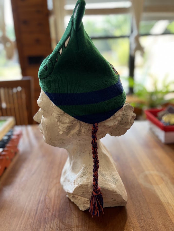 Gators mascot knit hat on display bust, opposite side