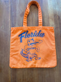 Orange cotton tote printed Florida with flexing Albert Gators mascot, front