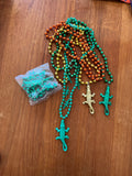 Lot of orange, gold and green bead necklaces with plastic alligator pendants and a bagged strand