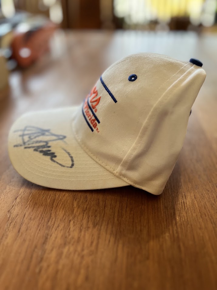 Signed Gators bar cap, angled view of signature on bill