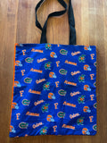 Handmade tote in all-over Florida Gators print with black webbing straps, front