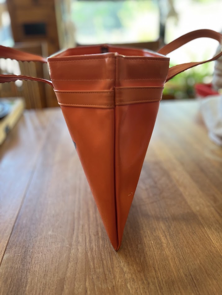 Orange vinyl Gators tote, end view