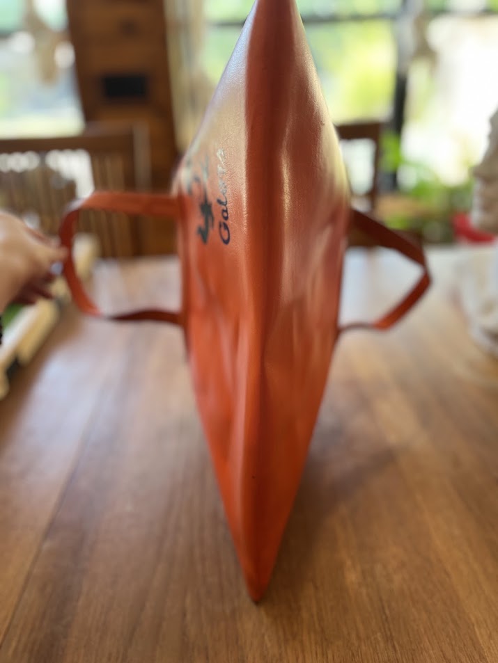 Orange vinyl Gators tote, angled side view